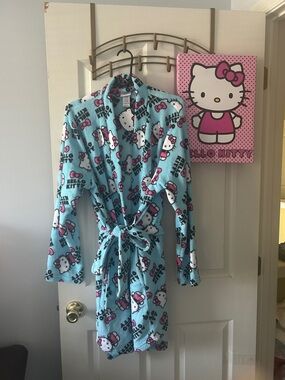 Hello Kitty Aqua Plush Robe with Pink Accents along Hello Kitty wall decor